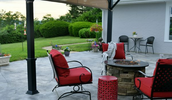 Comfortable outdoor living space with a gas fire pit during the day